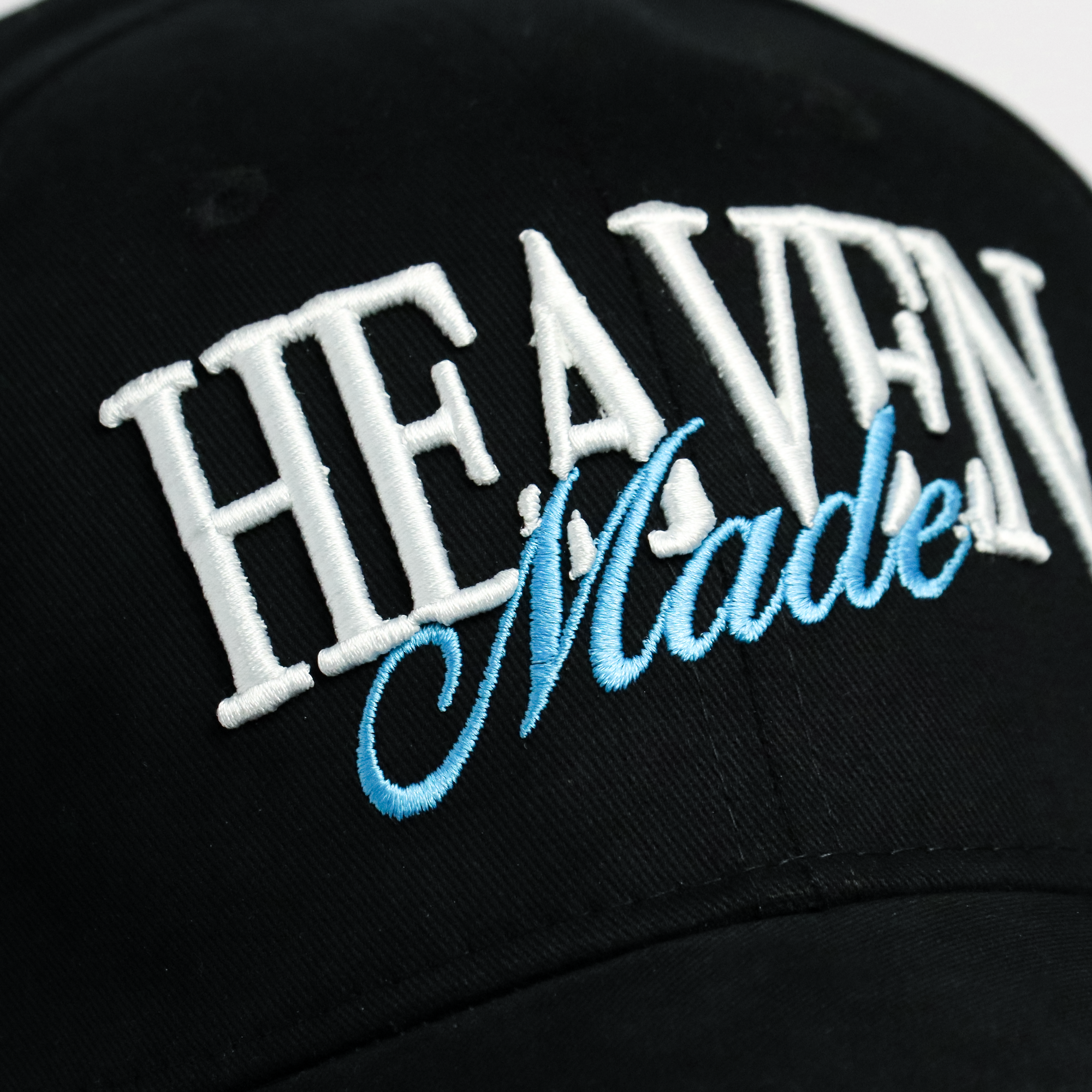 Back view of Heaven Made cap showing adjustable snapback closure and structured black crown