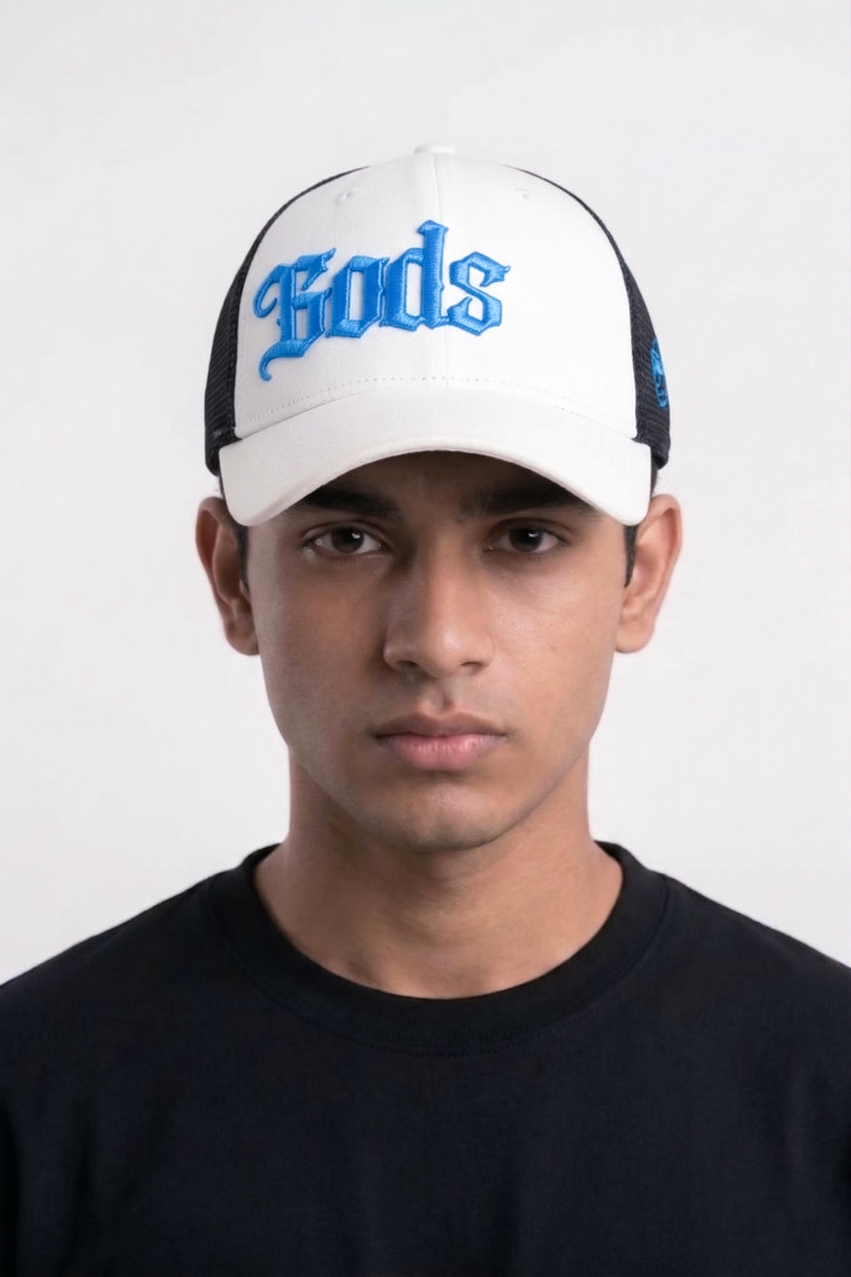 Man wearing Gods white and black embroidered trucker cap — best summer cap for men streetwear style India