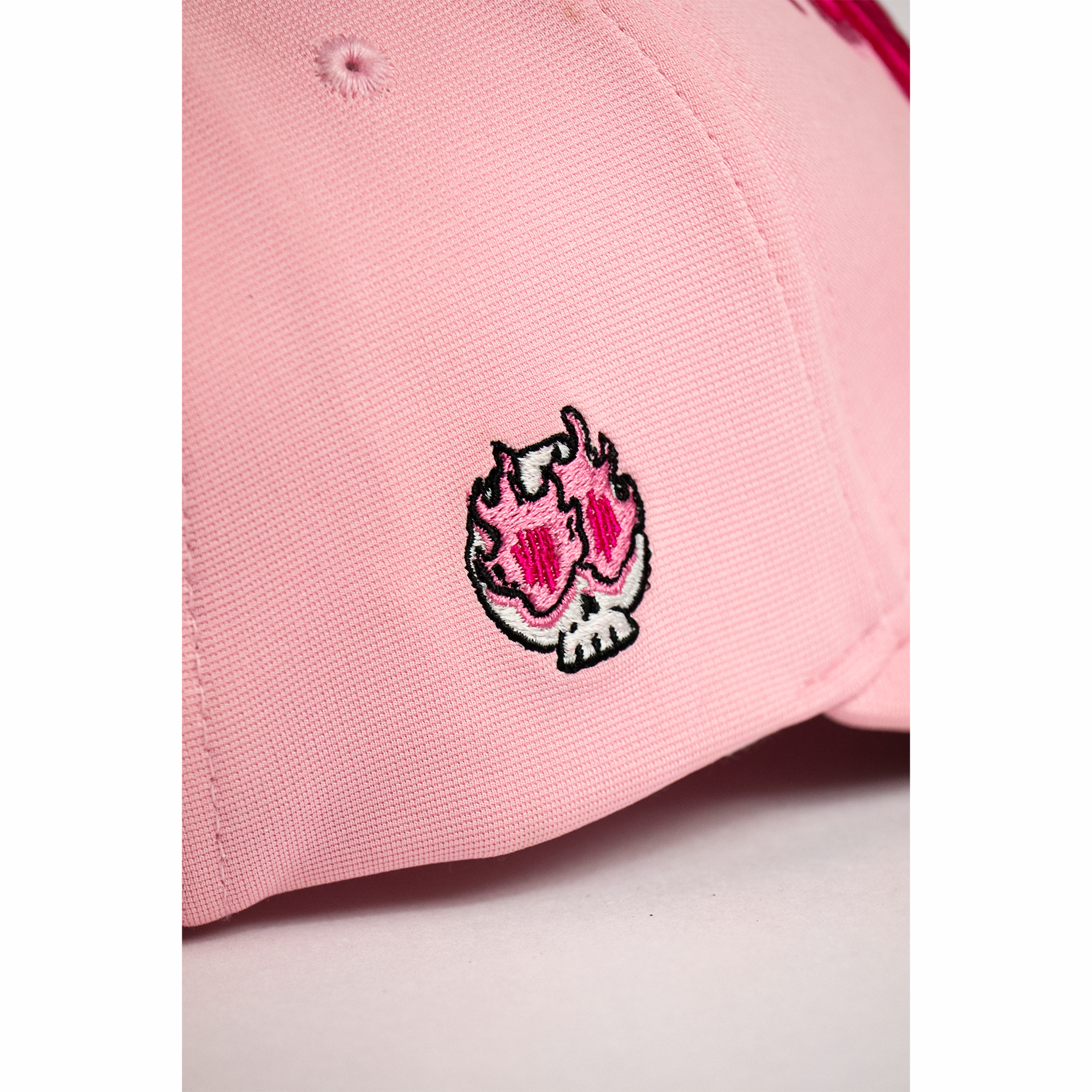 Woman wearing Nevermind pink flame embroidered baseball cap — best summer cap for women streetwear style India