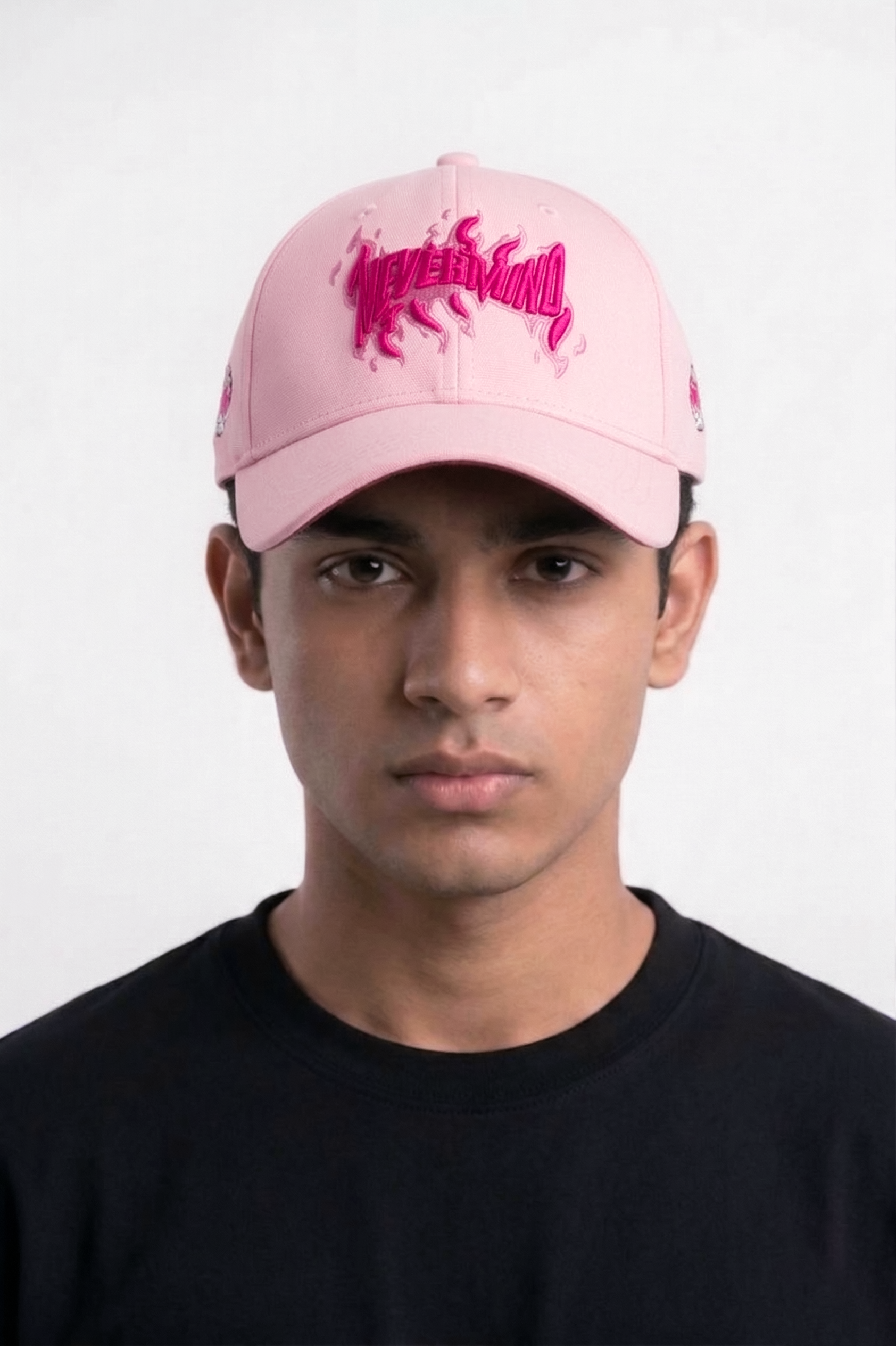 Woman wearing Nevermind pink flame embroidered baseball cap — best summer cap for women streetwear style India