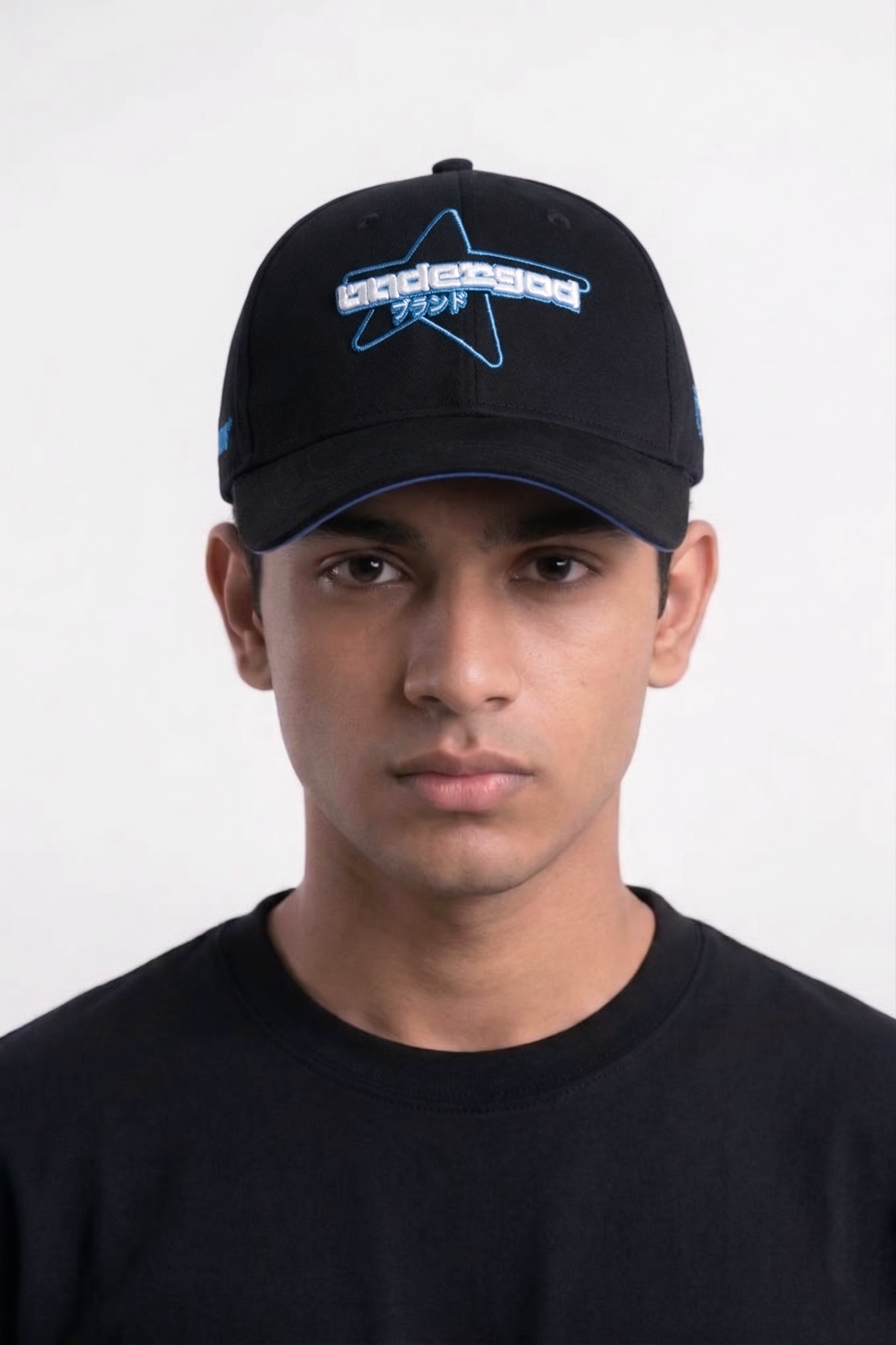 Man wearing Starmode black embroidered baseball cap with blue star logo — best summer cap for men Japanese streetwear style