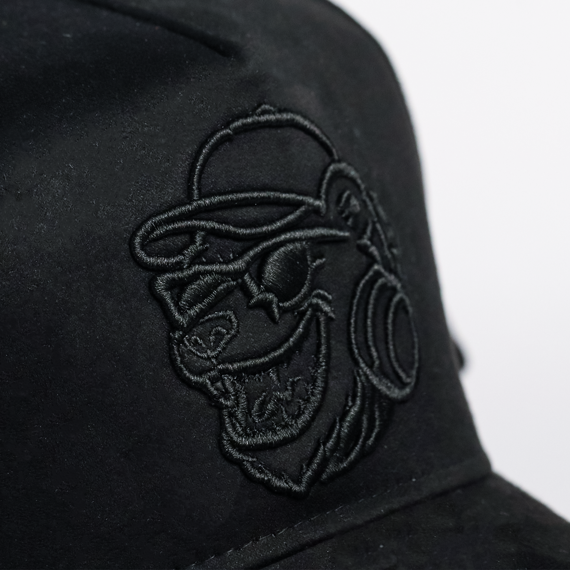 Black cap with embroidered logo on a white background, black suede streetwear cap undergods
premium streetwear snapback cap india
urban fashion cap black suede