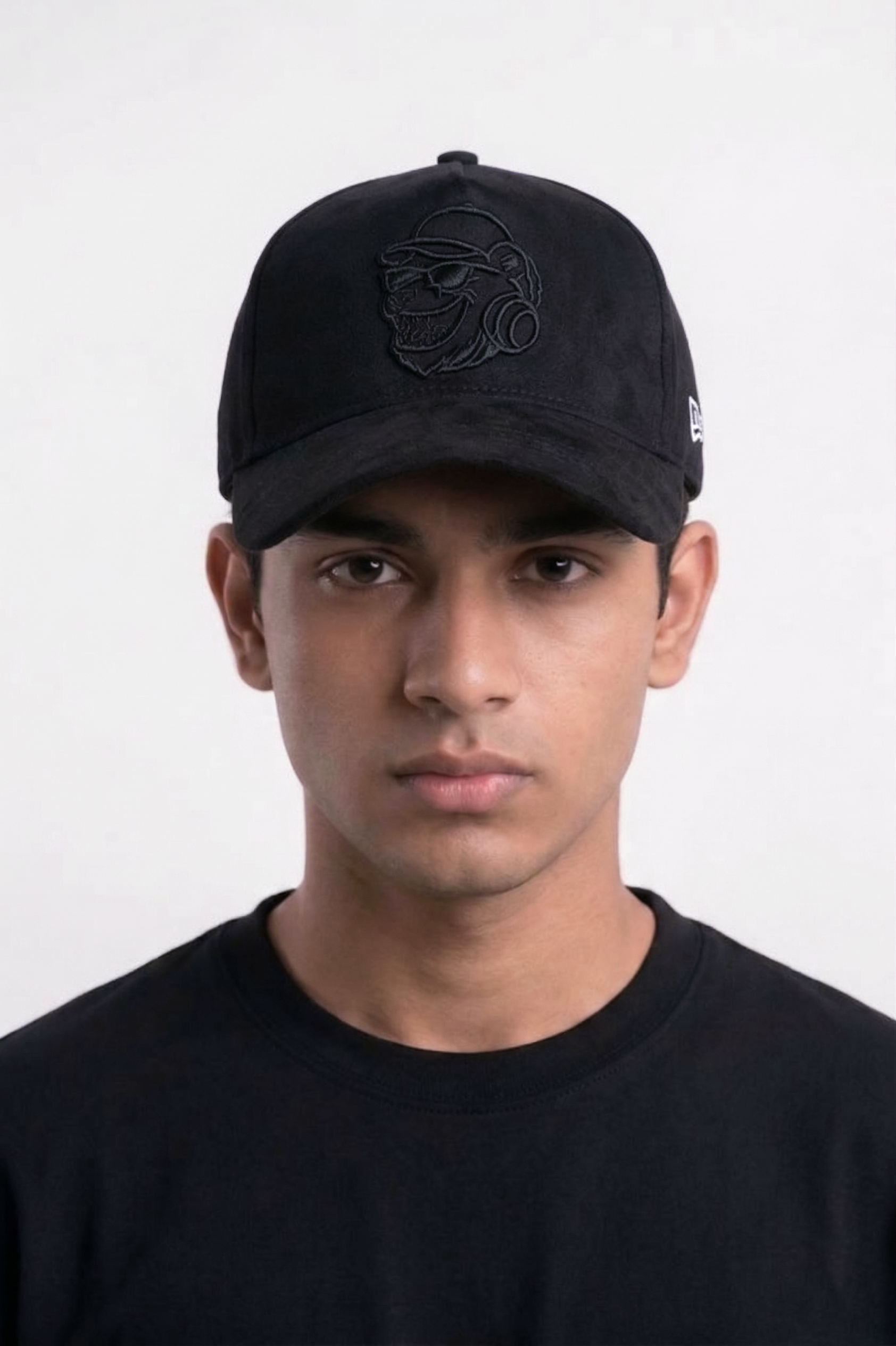 Man wearing a black cap with a logo on a white backgroundblack suede streetwear cap undergods
premium streetwear snapback cap india
urban fashion cap black suede
