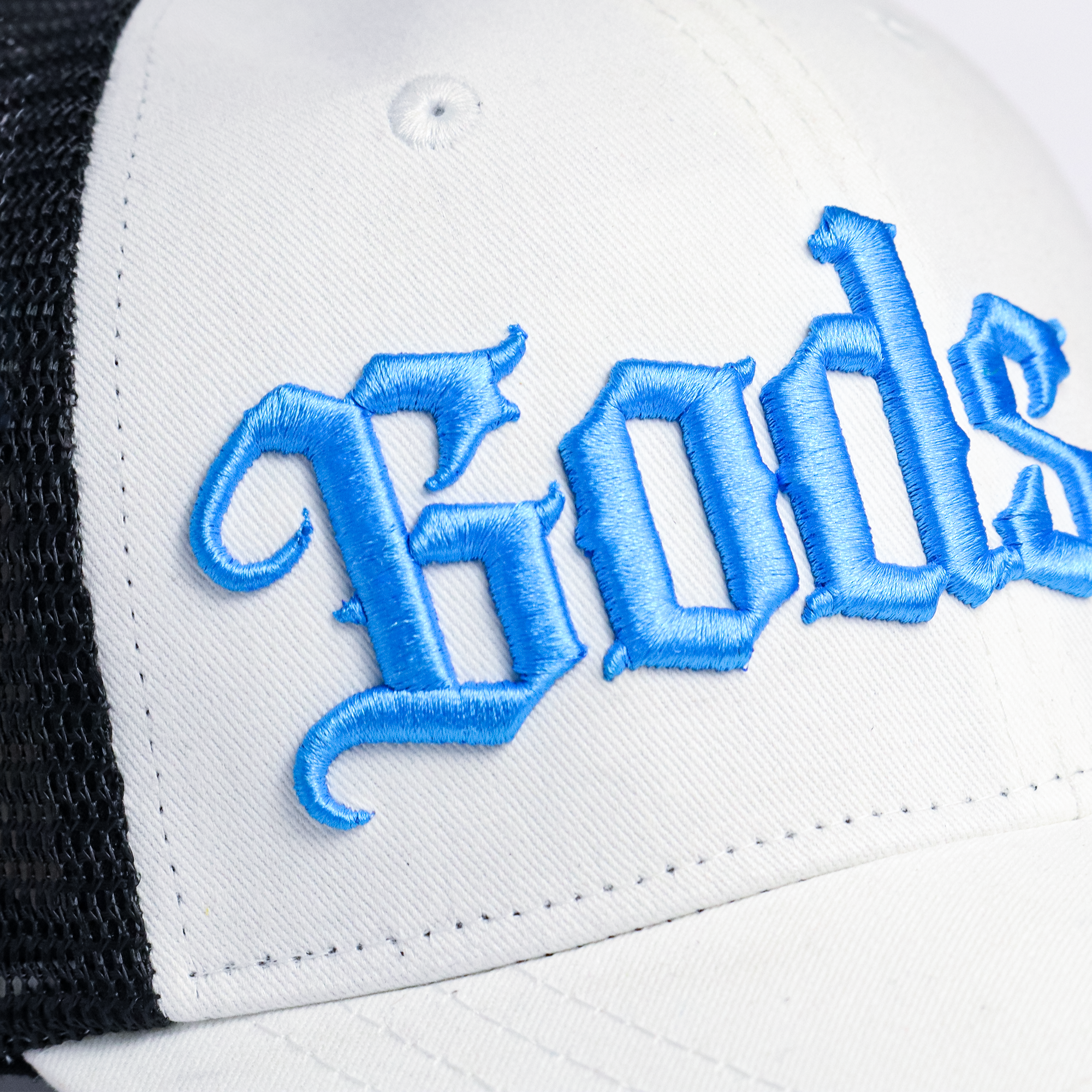 Back view of Gods black mesh trucker cap showing adjustable snapback closure — best white cap for men and women
