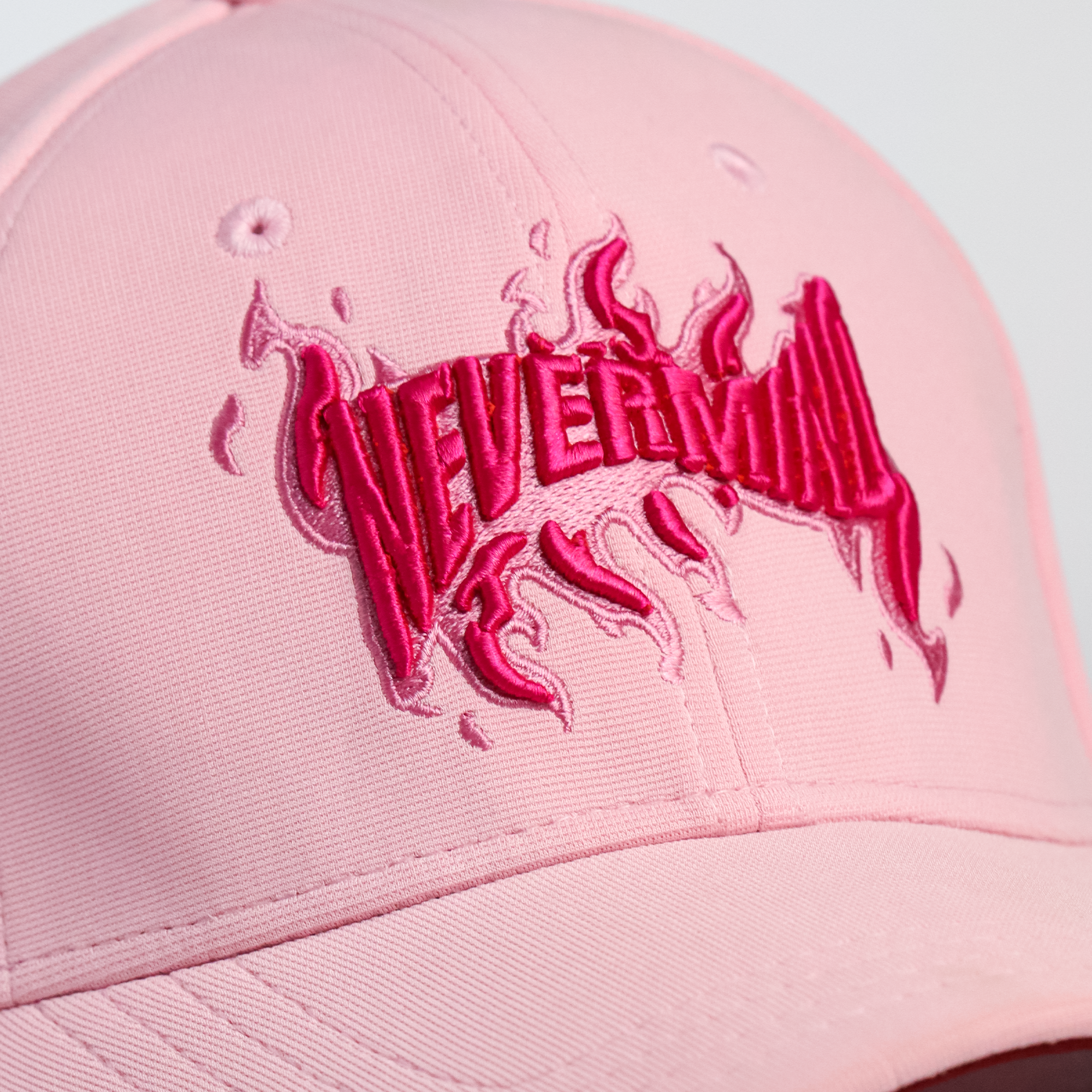 Back view of Nevermind pink snapback cap showing adjustable closure — best pink cap for women and men